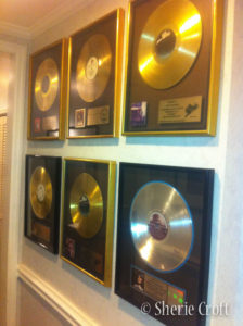 Gold records displayed on wall of Nashville sound studio.