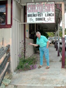 My mom the name artist outside a local cafe.