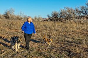 Carolyn Kendrick walking her dogs in Bluff, Utah.