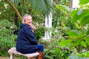 Judy, interviewed for Women Speak Hope, relaxes in the Butterfly Pavilion in Westminster, Colorado.